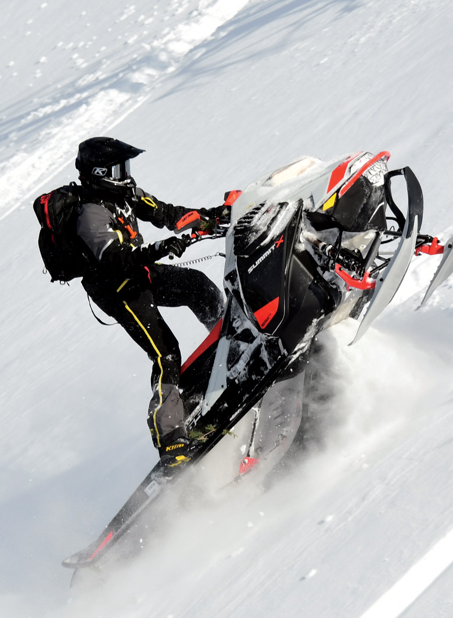 riding uphill on a snowmobile