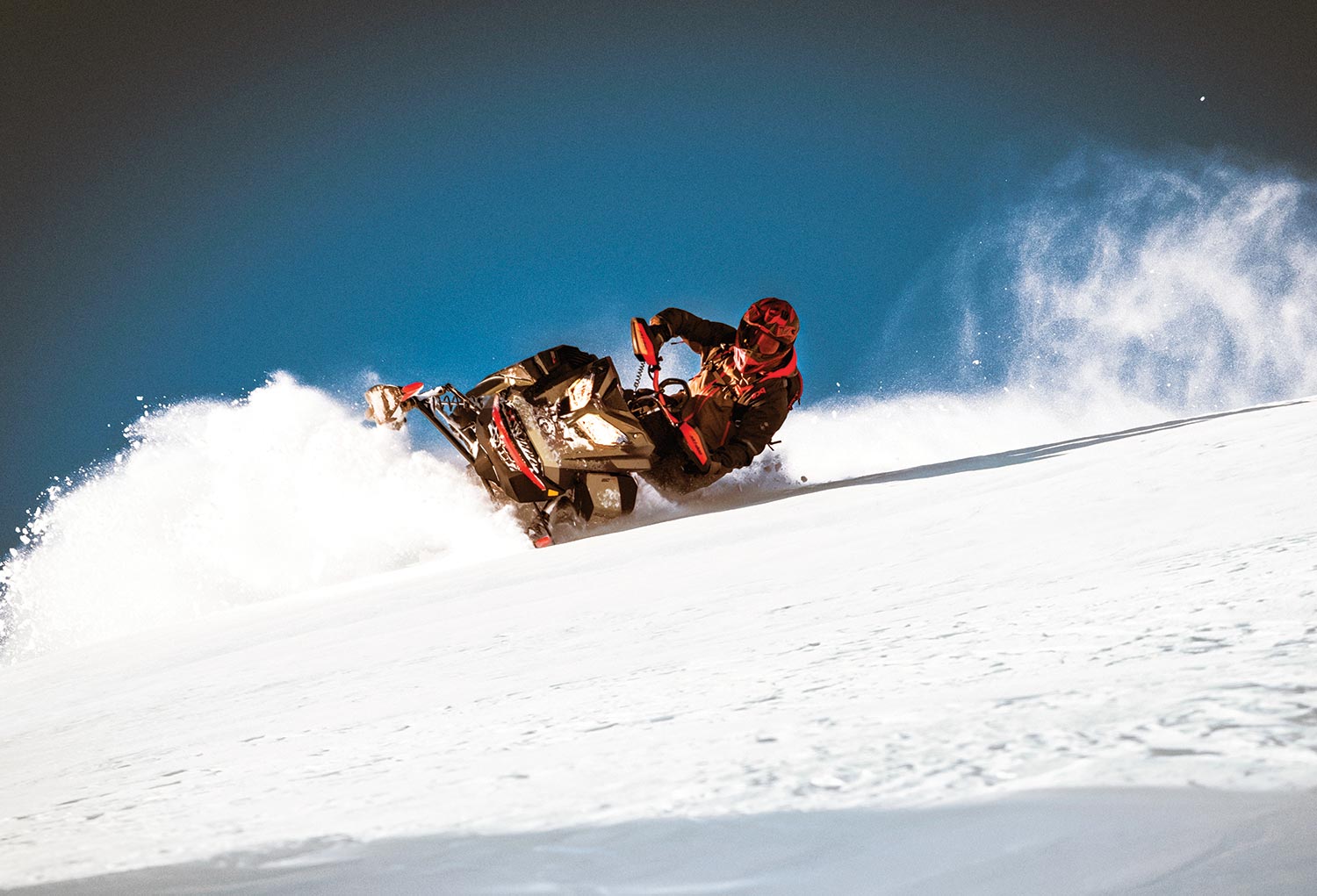 Man riding the 2022 Ski Doo down a hill