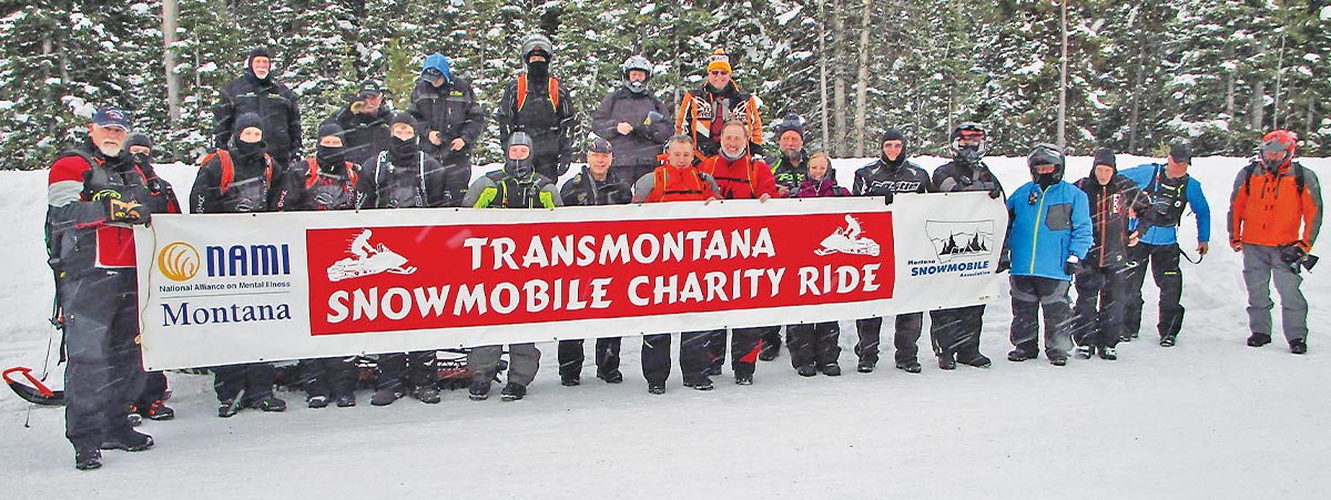 Montana Snowmobile Association’s Annual Trans Montana Charity Ride taking a group picture at the event