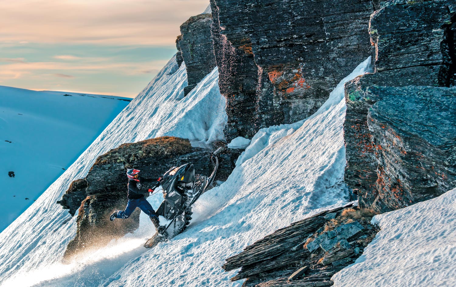 snowmobile rider on the mountain side