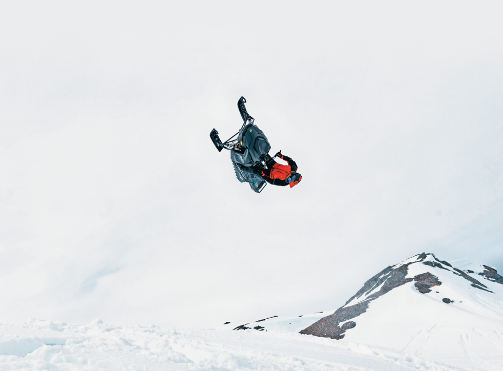 snowmobile rider doing a flip
