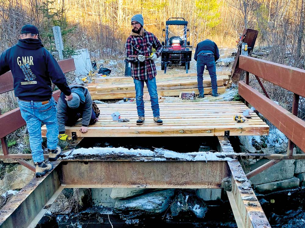 workers constructing a bridge