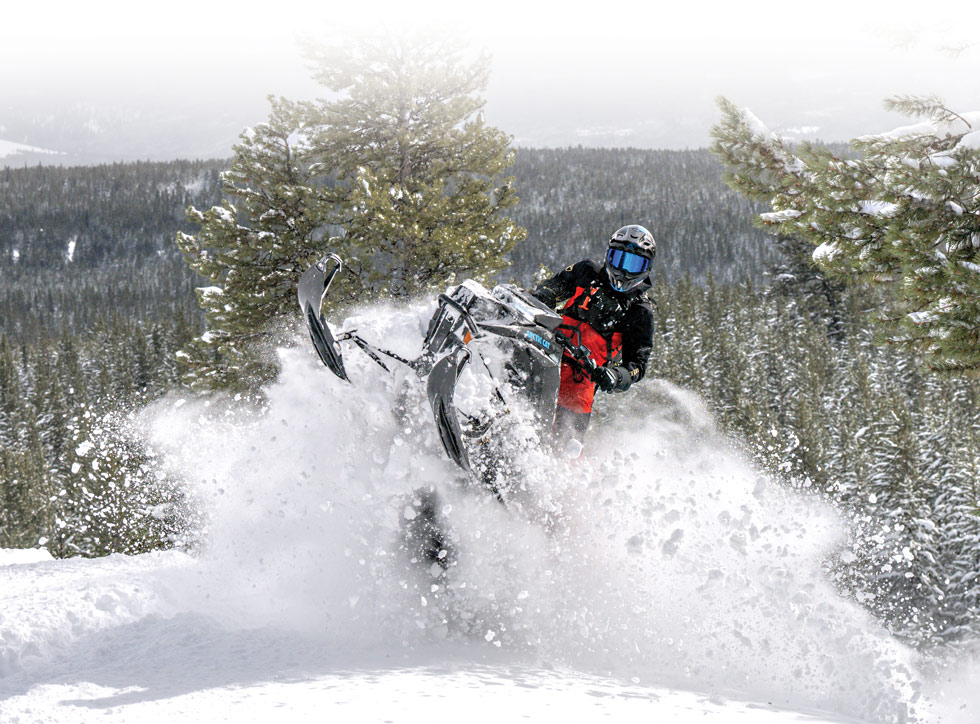snowmobile rider wearing a red suit