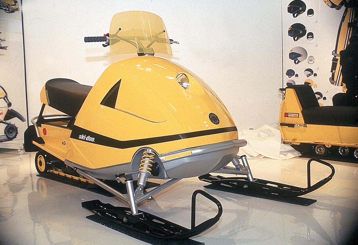 quarter view of a yellow early model Ski-Doo on display