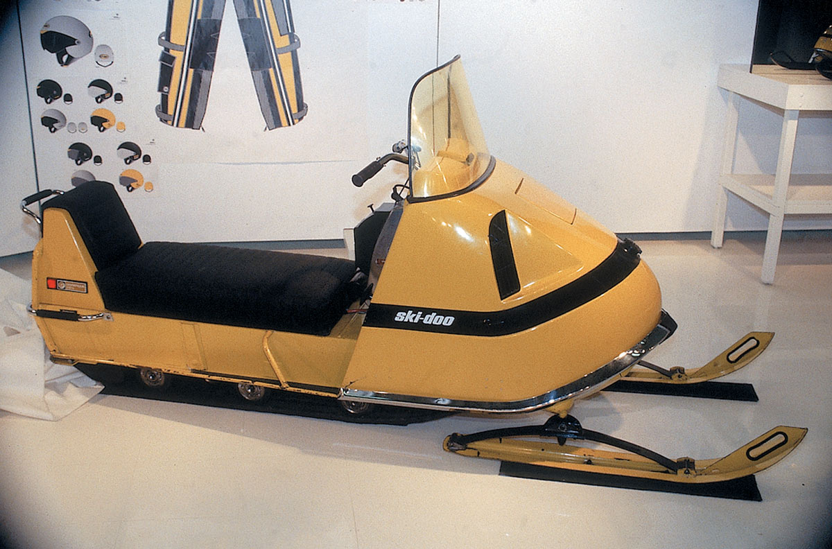 quarter view of a yellow Ski-Doo Super on display